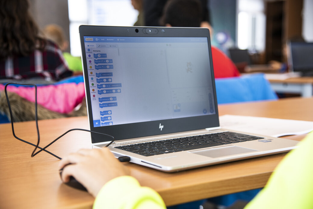 Laptop on which a child learns coding